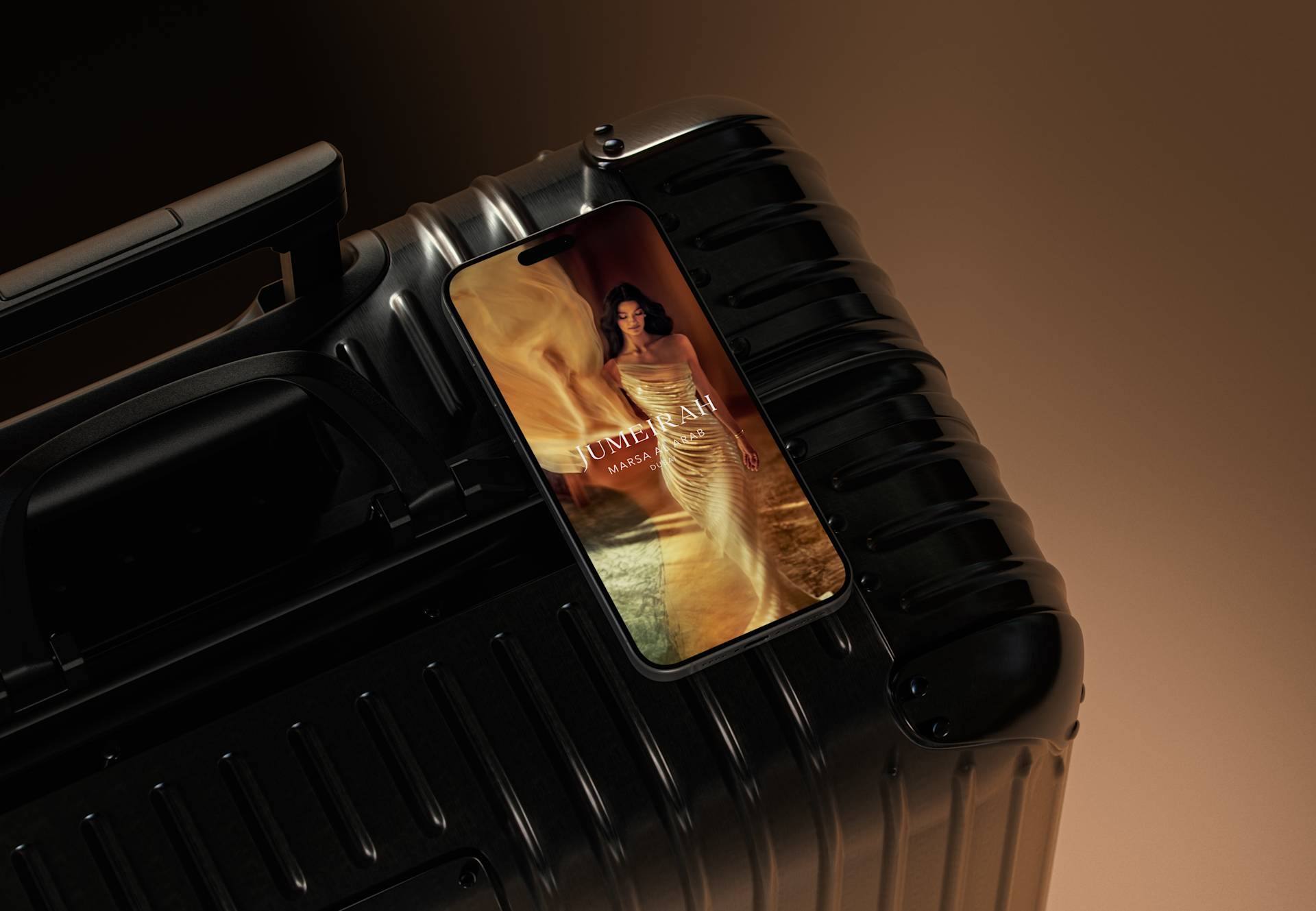 A smartphone displaying a woman in a gold dress rests on top of a black hard-shell suitcase against a brown gradient background.