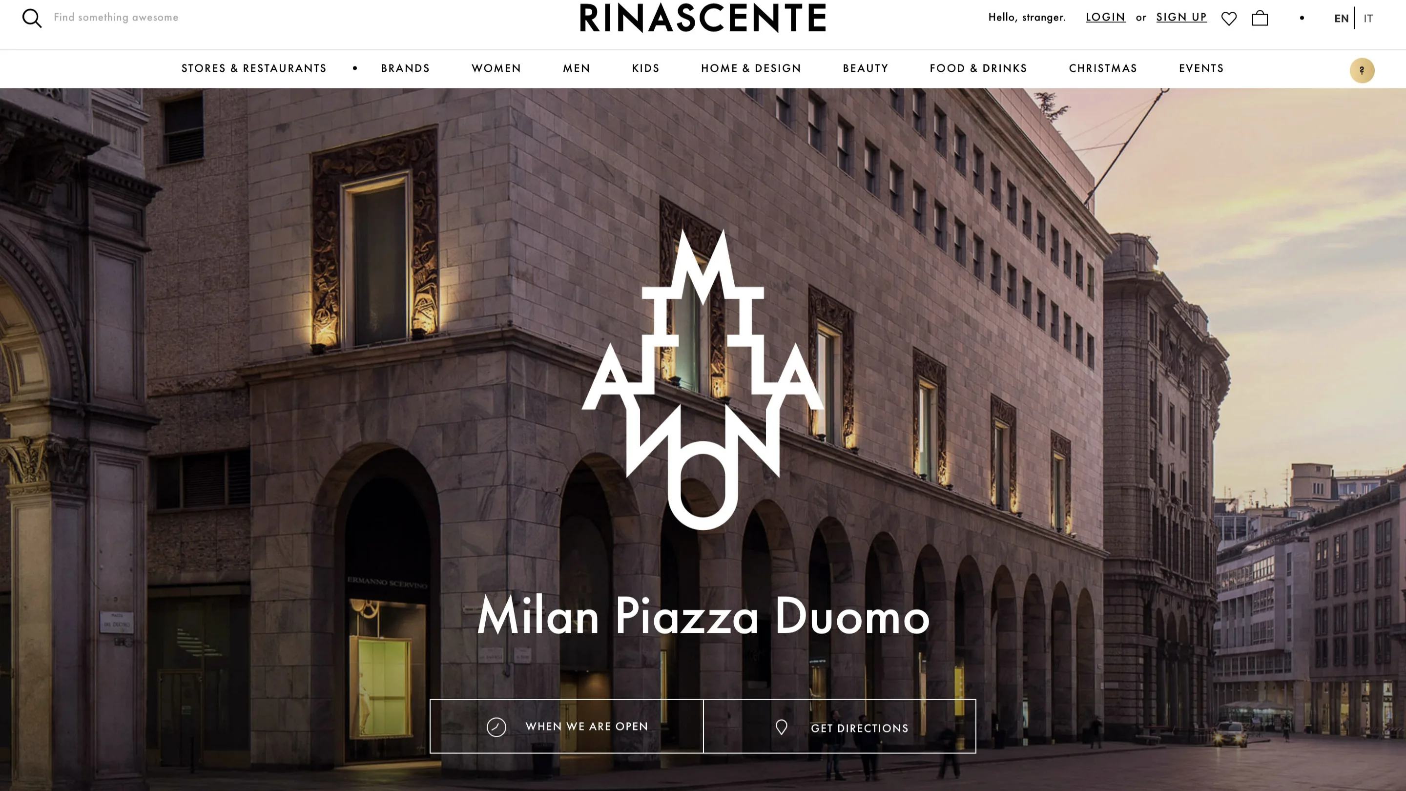 Front view of Rinascente department store in Milans Piazza Duomo at dusk, with arched windows and tall columns, city street in foreground, and a logo graphic and navigation menu displayed on the website.