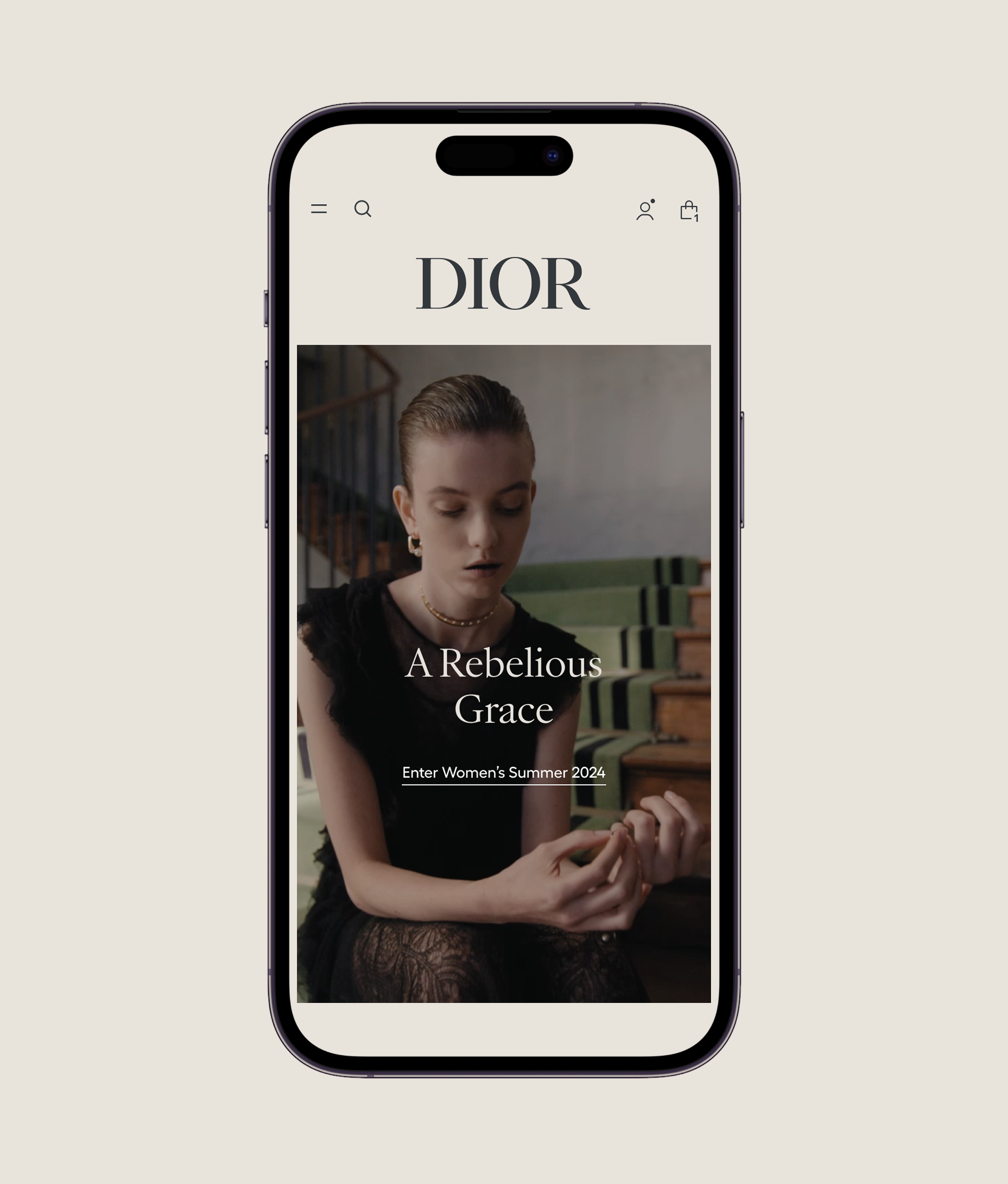 A smartphone displays the Dior website featuring a woman in a black dress sitting on stairs, with the headline A Rebellious Grace and Enter Womens Summer 2024 on the screen.