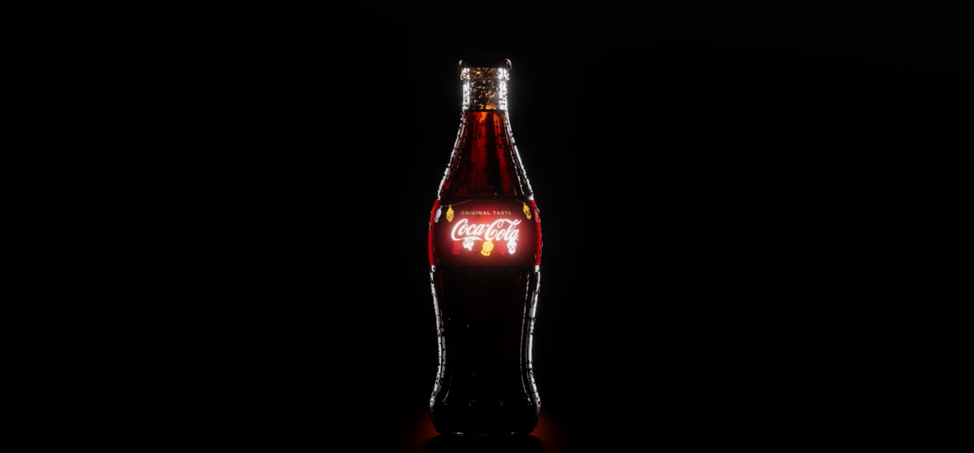 A classic glass Coca-Cola bottle stands upright against a black background, with the red and white Coca-Cola logo prominently illuminated on the label.