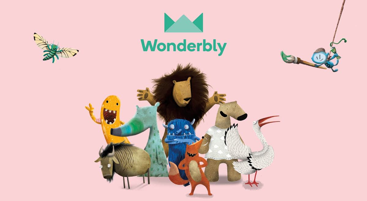 A group of colorful, illustrated animals and creatures stand together on a pink background, with the word Wonderbly and a green crown-like logo above them. A small blue character swings from a vine in the corner.
