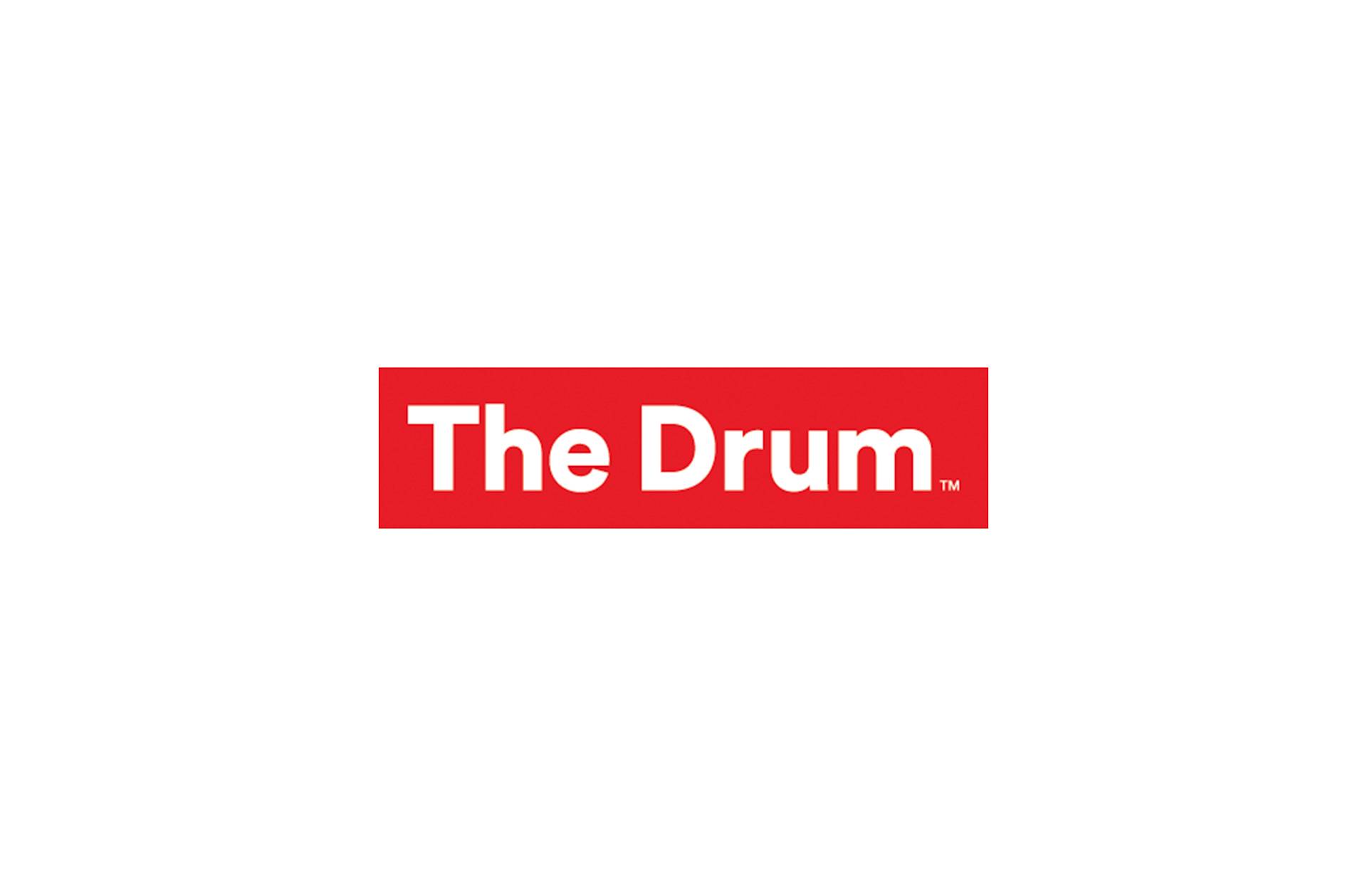 Logo for The Drum featuring white text on a red rectangular background.