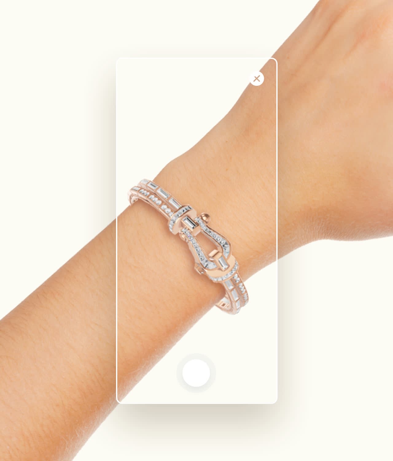 A hand wearing a sparkling, diamond-studded bracelet is shown with a smartphone camera interface overlay, as if the bracelet is being photographed.