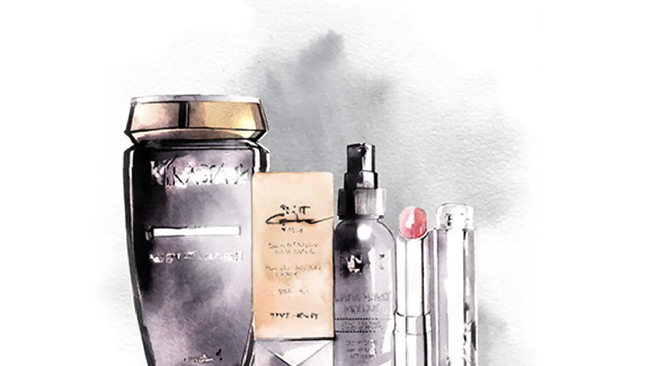 A watercolor-style illustration of various luxury skincare and beauty products, including bottles, a pump, a lipstick, a box, and a tall jar, arranged side by side on a light background.