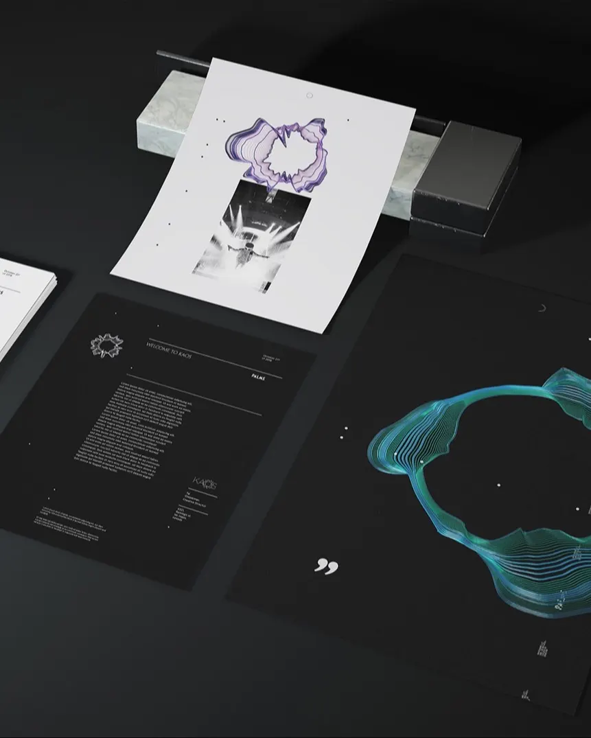 A set of modern, stylish prints and documents lies on a dark surface, featuring abstract line art, text, and geometric designs in black, white, purple, and teal tones. One sheet is elevated above the others.
