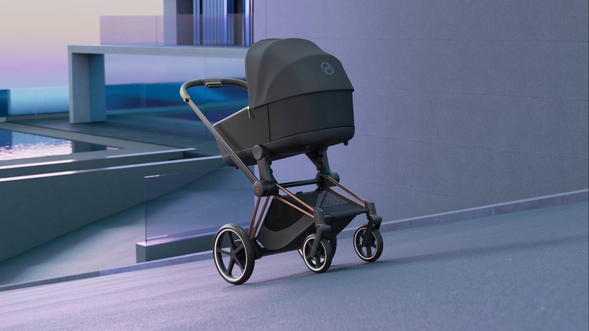 A modern black baby stroller with a sleek design is positioned on a smooth, sloped surface near a contemporary building with glass railings and a pool in the background.