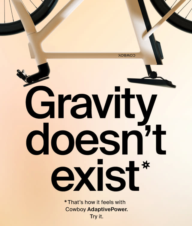 Partial image of a bicycle above bold text reading “Gravity doesn’t exist*.” Smaller text below says, “*That’s how it feels with Cowboy AdaptivePower. Try it.”.