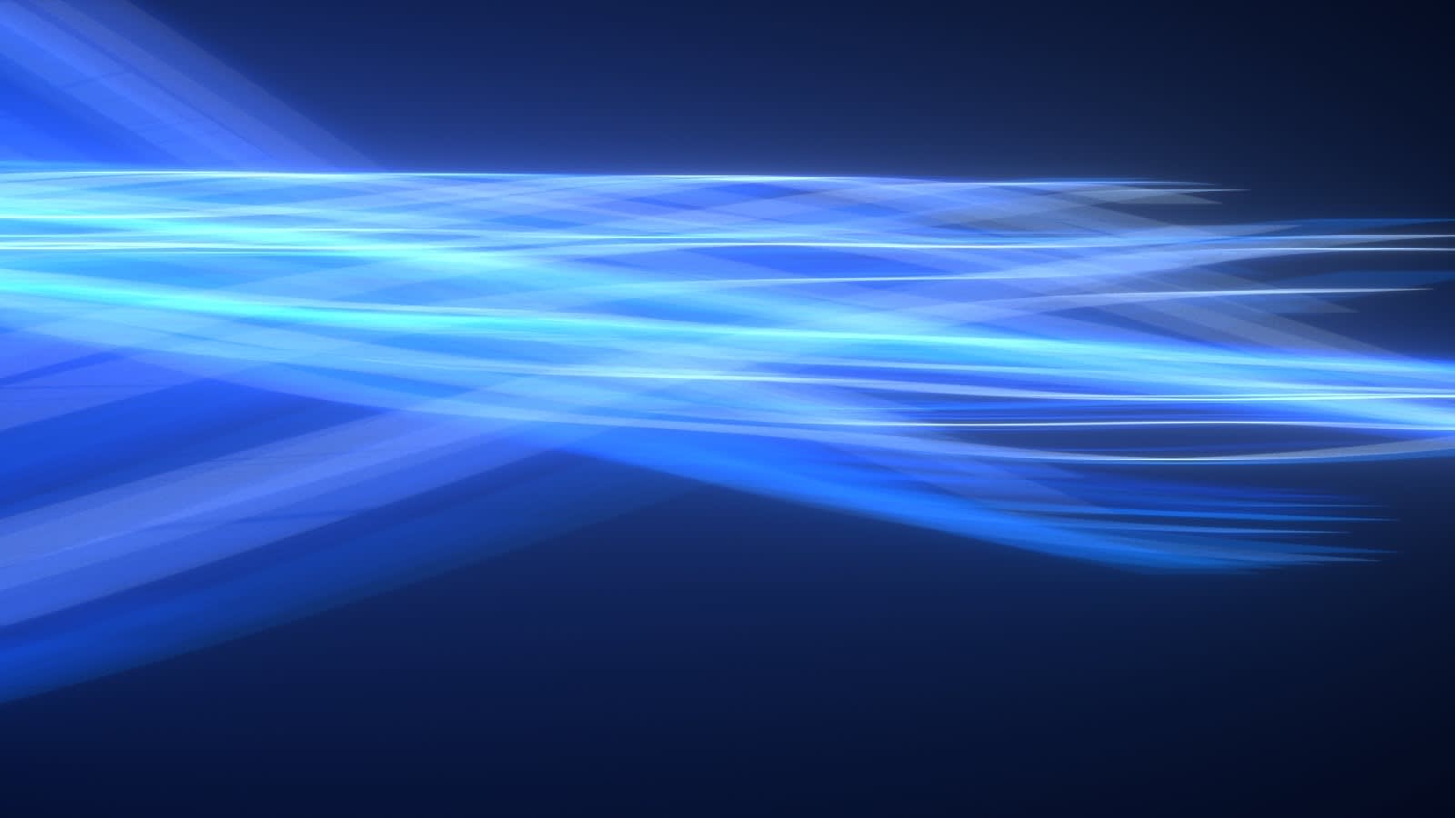 Abstract image featuring overlapping streaks of blue and white light on a dark background, creating a sense of motion and energy.
