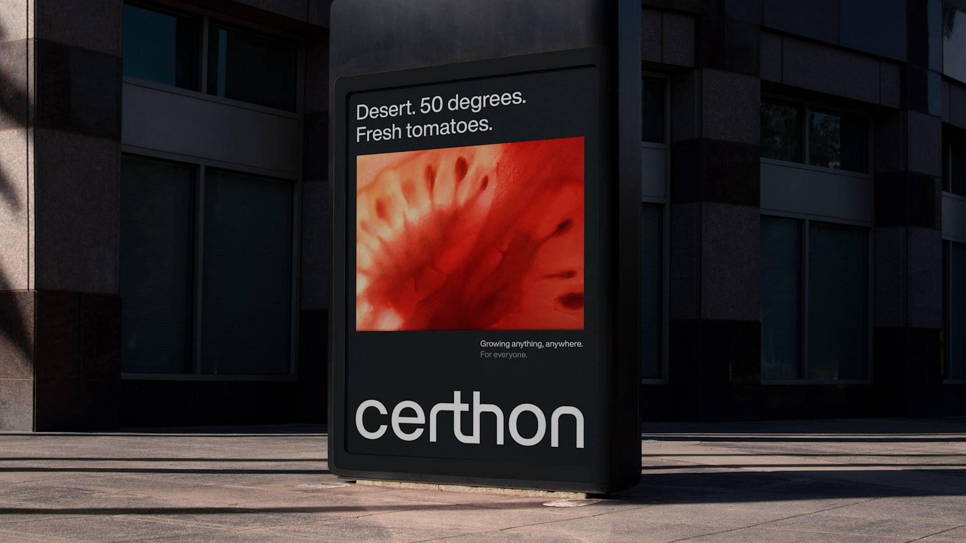 A sidewalk billboard displays a close-up image of a tomato with text above it reading, Desert. 50 degrees. Fresh tomatoes. Below the image, the logo certhon is prominently featured.