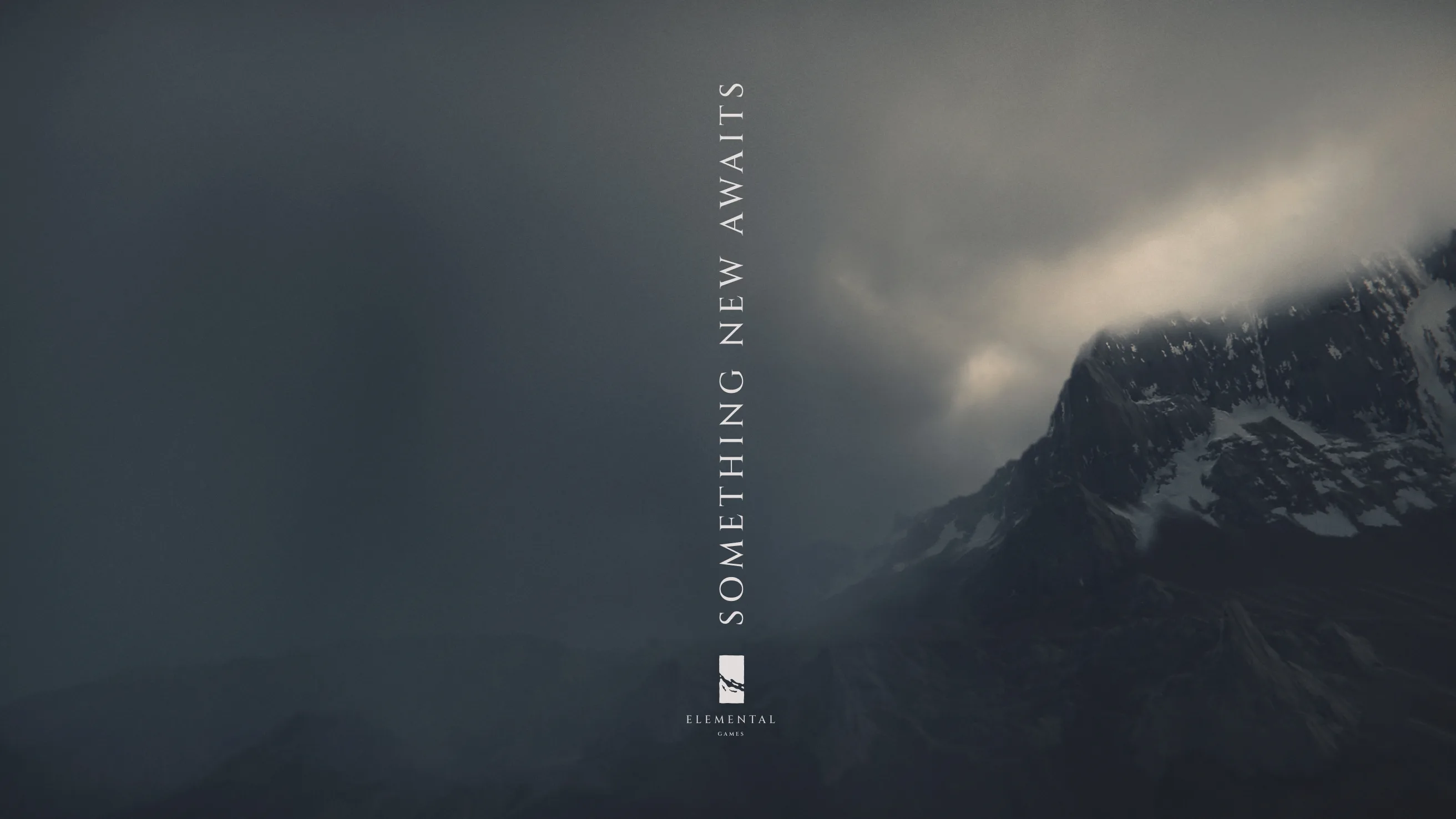 A dark, moody mountain landscape with dramatic clouds and sunlight. Vertical text in the center reads “SOMETHING NEW AWAITS” above a minimalist logo labeled “ELEMENTAL GAMES.”.