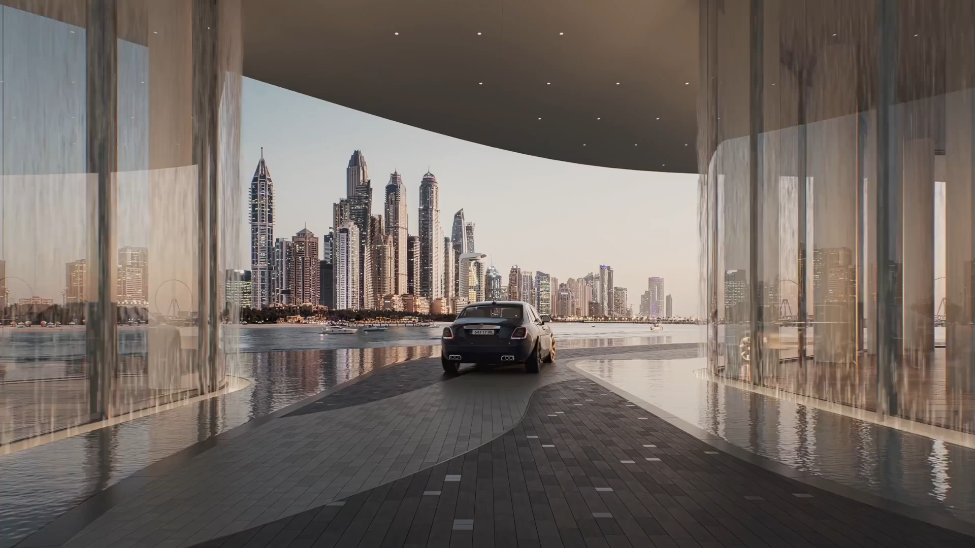 A luxury car drives through a modern, open-air structure with glass walls, overlooking a city skyline filled with tall skyscrapers by the waterfront at sunset.