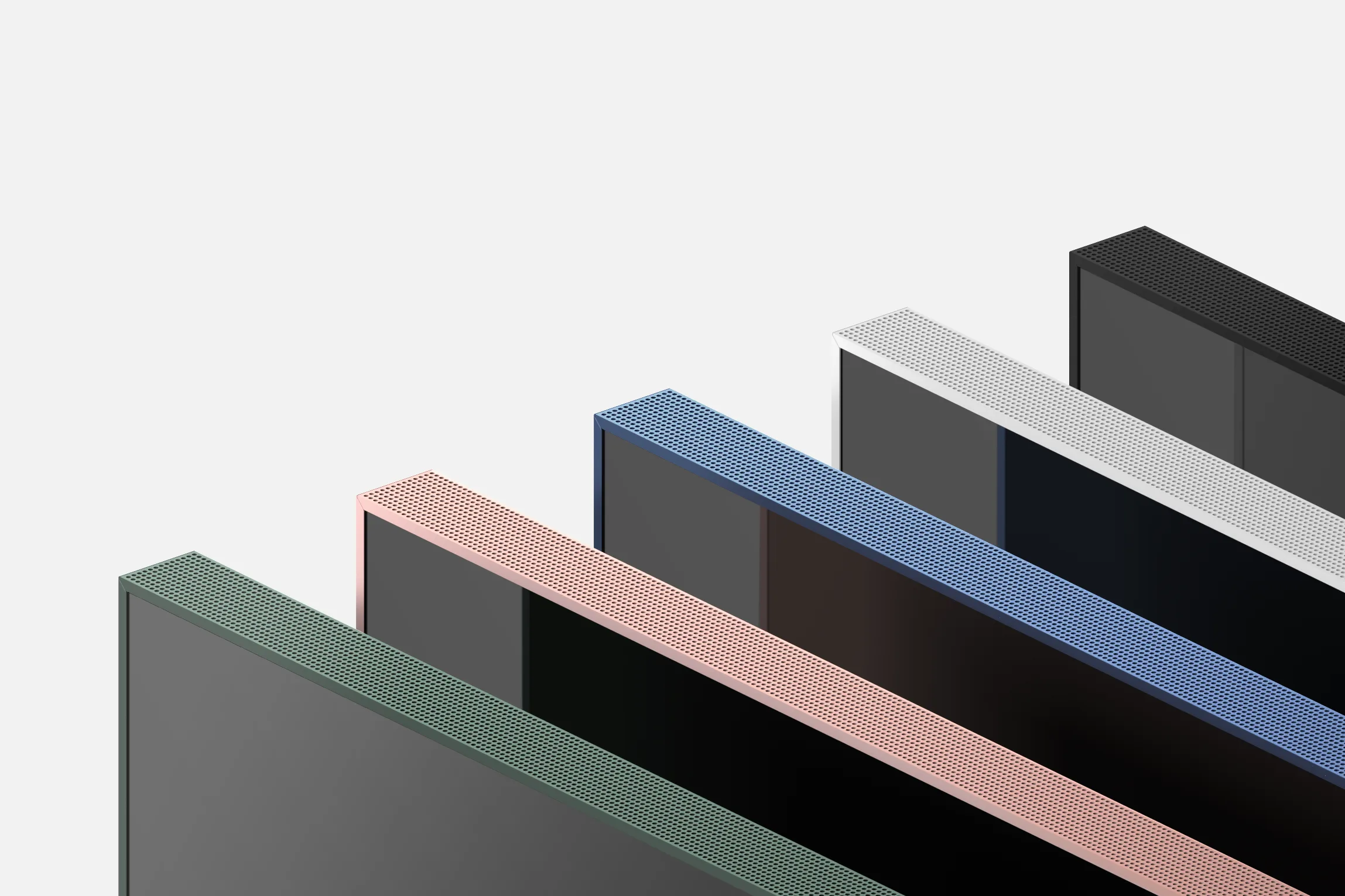 Several flat screen monitors are arranged diagonally in parallel rows. Each has a colored trim—green, pink, blue, white, and black—against a light background, creating a geometric and modern composition.
