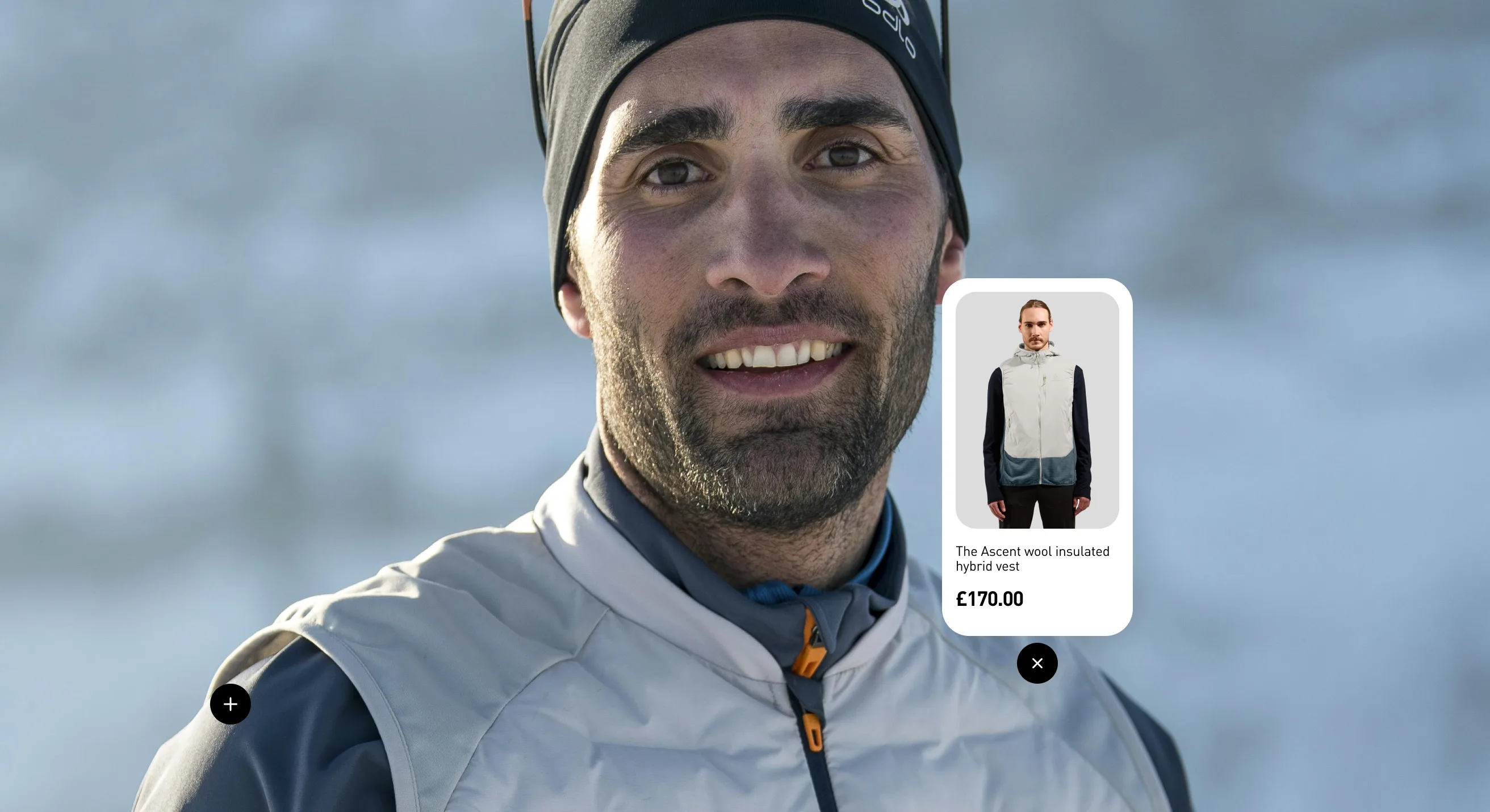 A smiling man in a beanie and insulated vest, with a product pop-up showing a hybrid vest and its price. The background is a blurry snowy landscape.