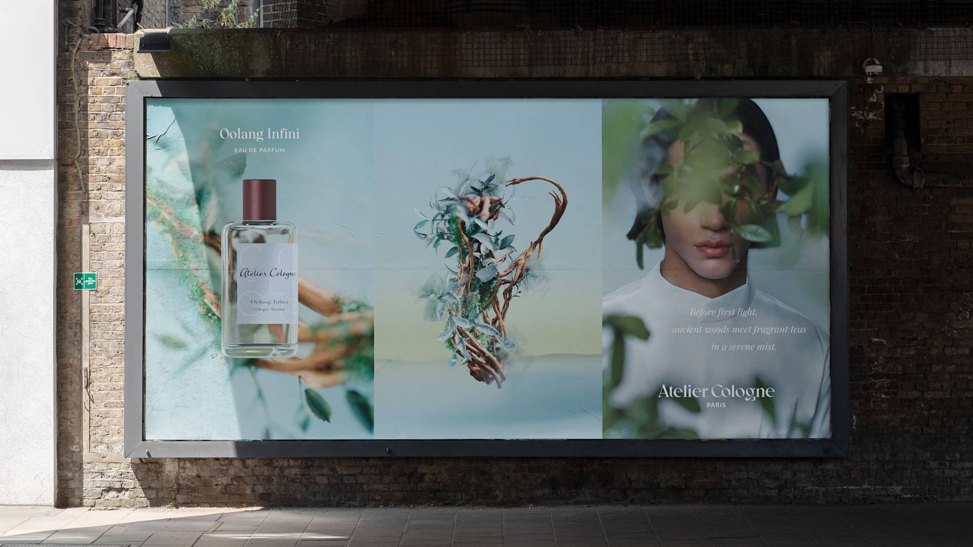 A billboard ad for Atelier Cologne features a perfume bottle, an abstract plant arrangement, and a partial face of a person surrounded by leaves against soft blue and green backgrounds.