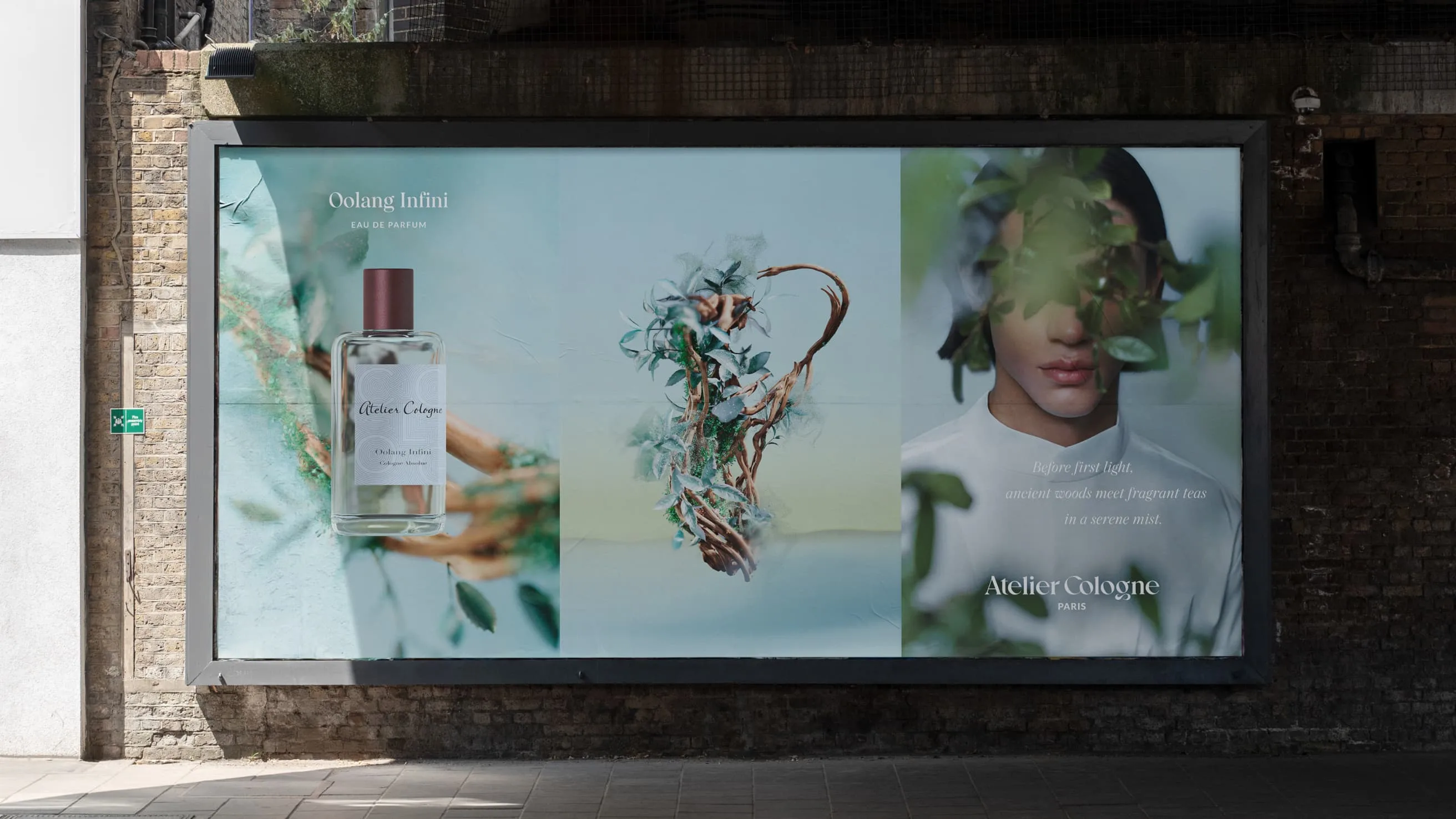 A billboard ad for Atelier Cologne features a perfume bottle, an abstract plant arrangement, and a partial face of a person surrounded by leaves against soft blue and green backgrounds.