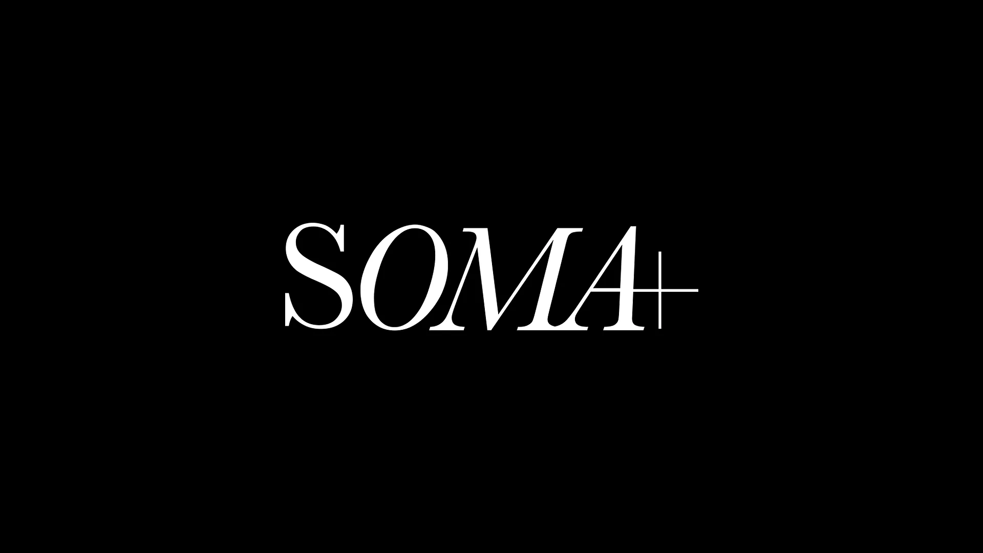 White serif text SOMA+ is centered on a solid black background. The letter A has an extended horizontal line, and a plus sign appears immediately after the word.