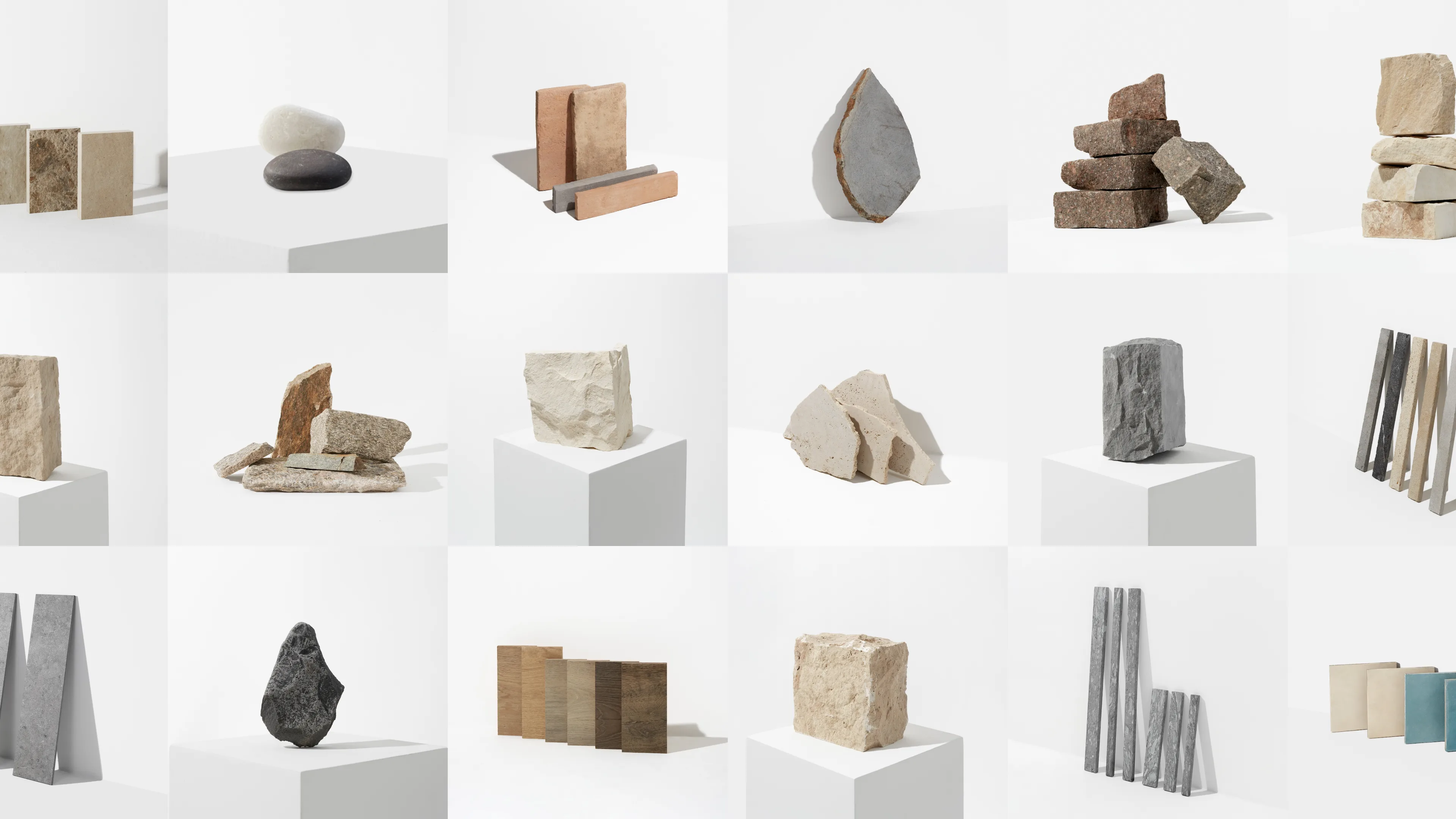 A grid of 16 images shows various geometric arrangements of stones, bricks, and rectangular wooden or concrete blocks, each displayed on white cubes or pedestals against a plain white background.