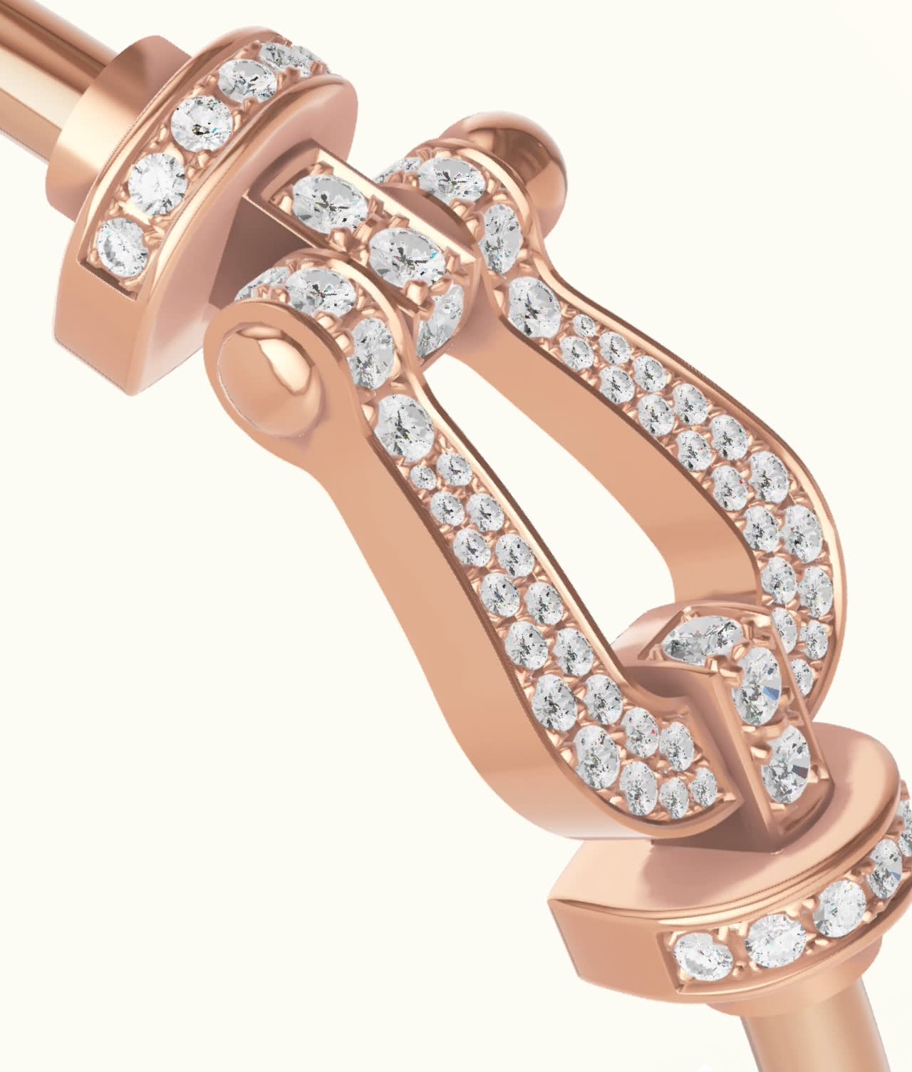 Close-up of a rose gold jewelry clasp encrusted with numerous small, round white gemstones in intricate patterns, set against a light background.