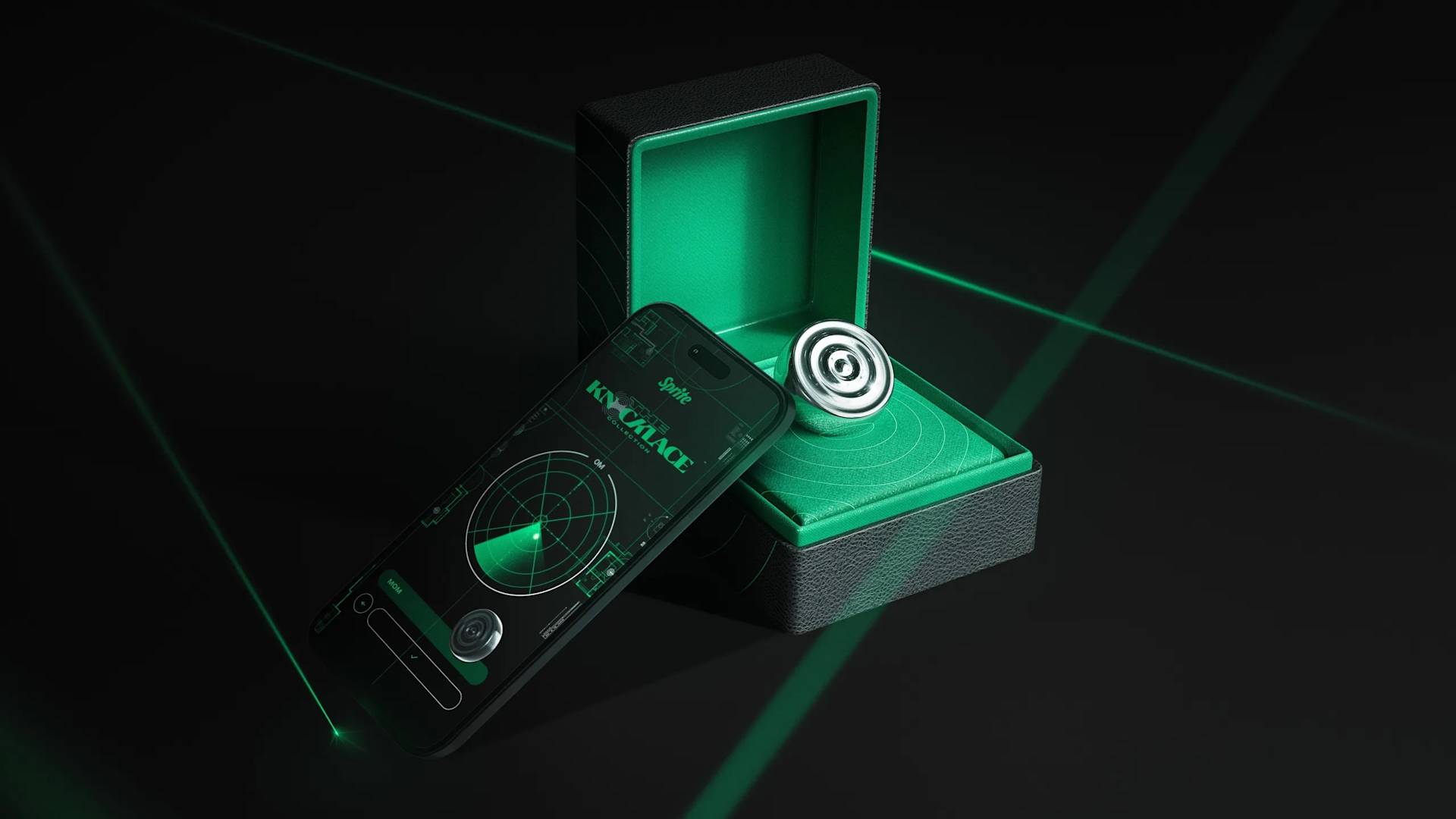 A futuristic, glowing green ring is displayed in an open box beside a smartphone showing a radar-like app interface. Green lasers and a dark background create a high-tech atmosphere.