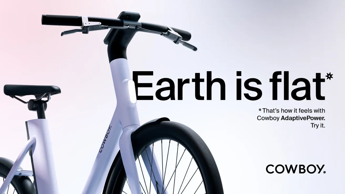 A sleek, modern electric bicycle with COWBOY branding is shown against a gradient background. Large text reads Earth is flat* with a note about Cowboy AdaptivePower technology and the COWBOY logo at the bottom right.