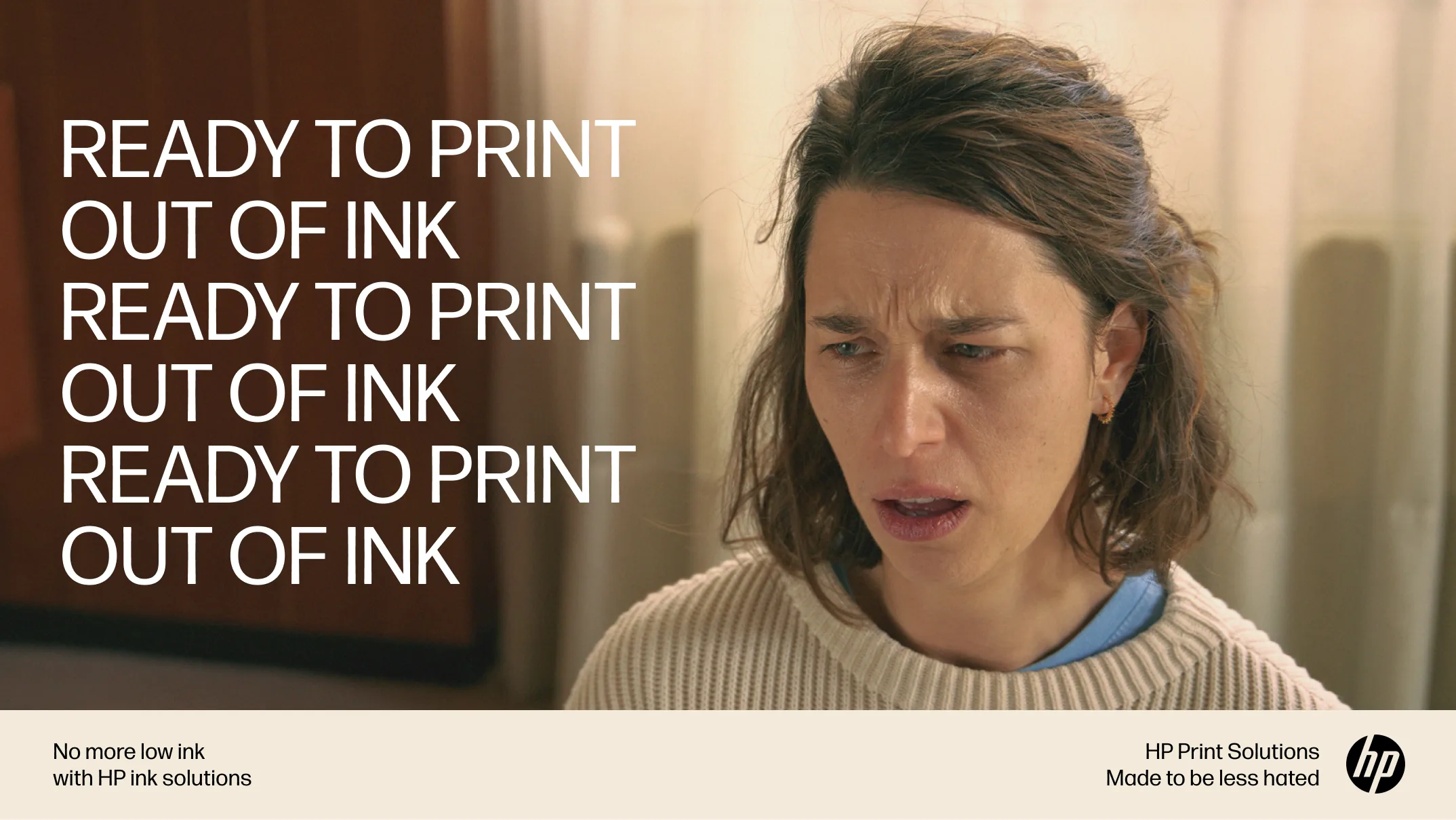 A woman with a frustrated expression sits indoors; to her left, repeated text reads, READY TO PRINT OUT OF INK. At the bottom, there is HP branding and a message about print solutions ending low ink issues.