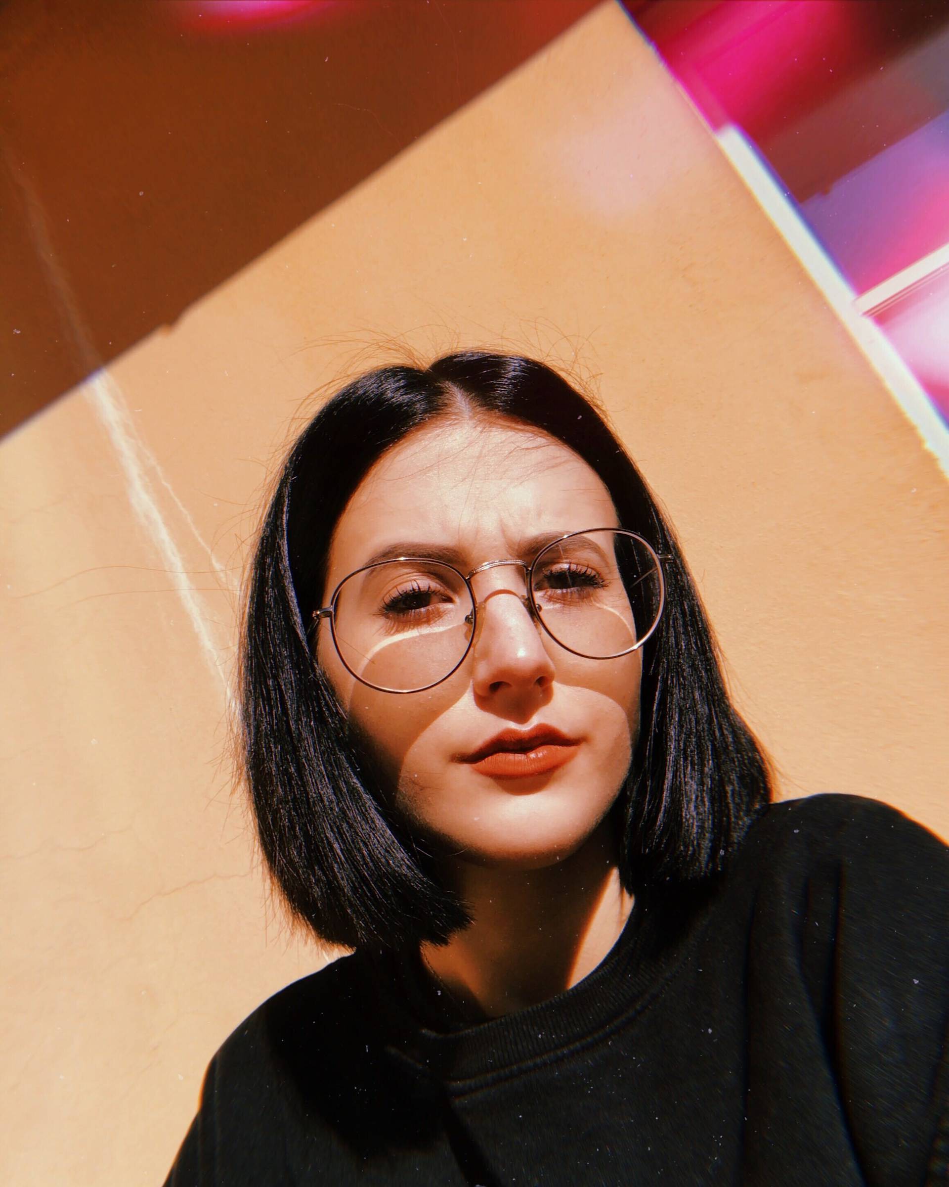 A woman taking a selfie.