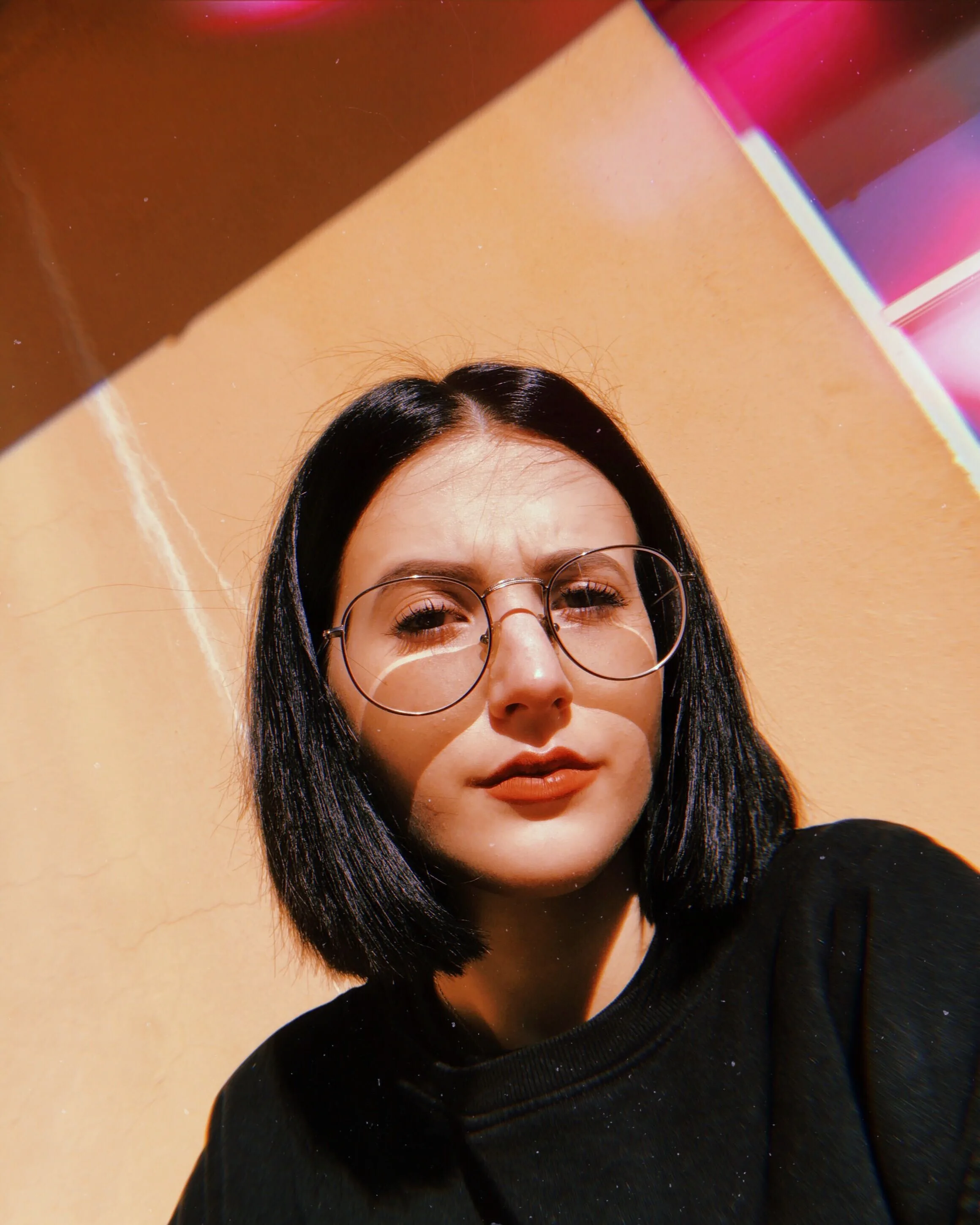 A woman taking a selfie.