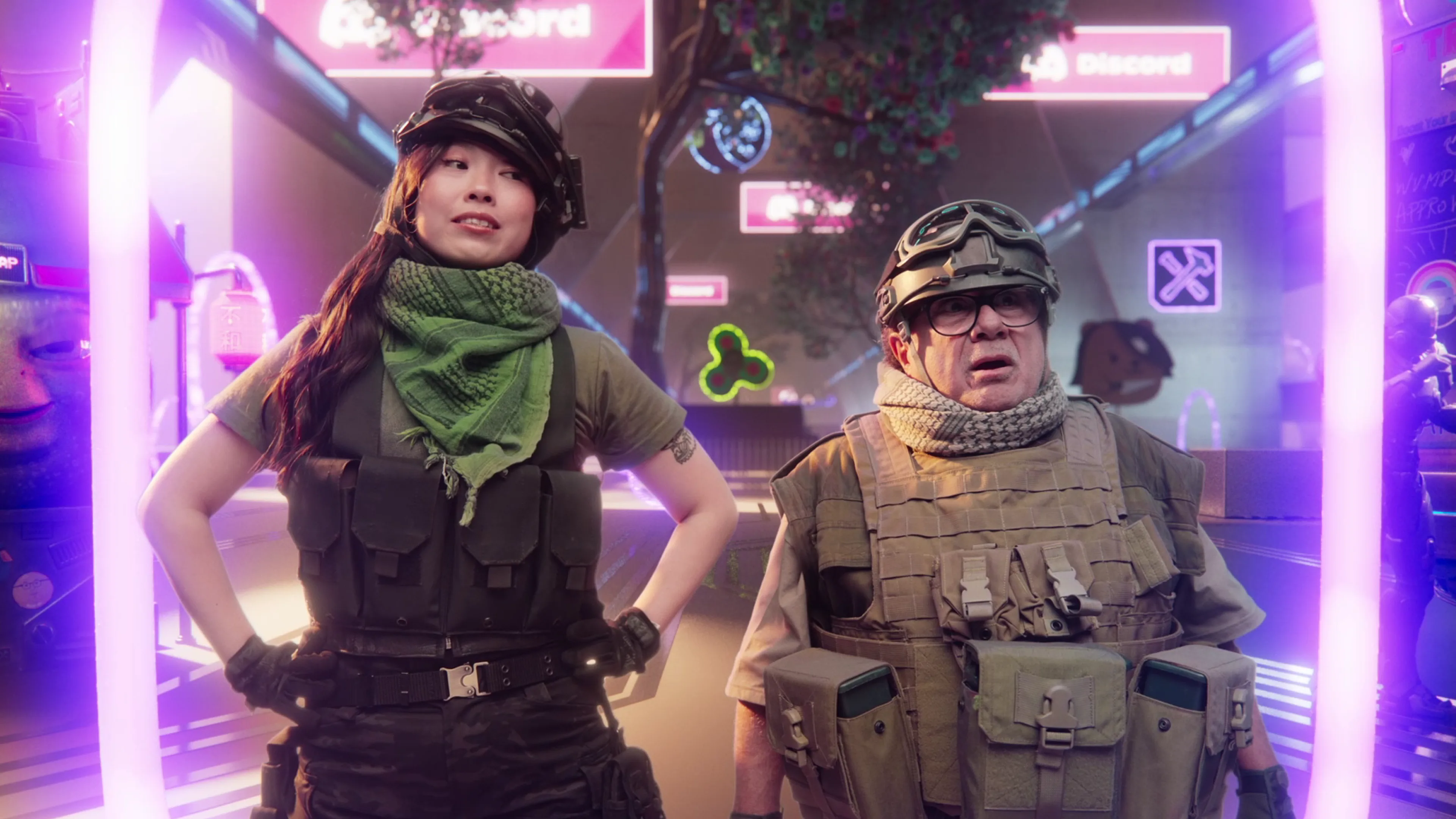 Two people in tactical gear and helmets stand in a neon-lit, futuristic setting with Discord logos and digital signs in the background, appearing alert and ready for action.