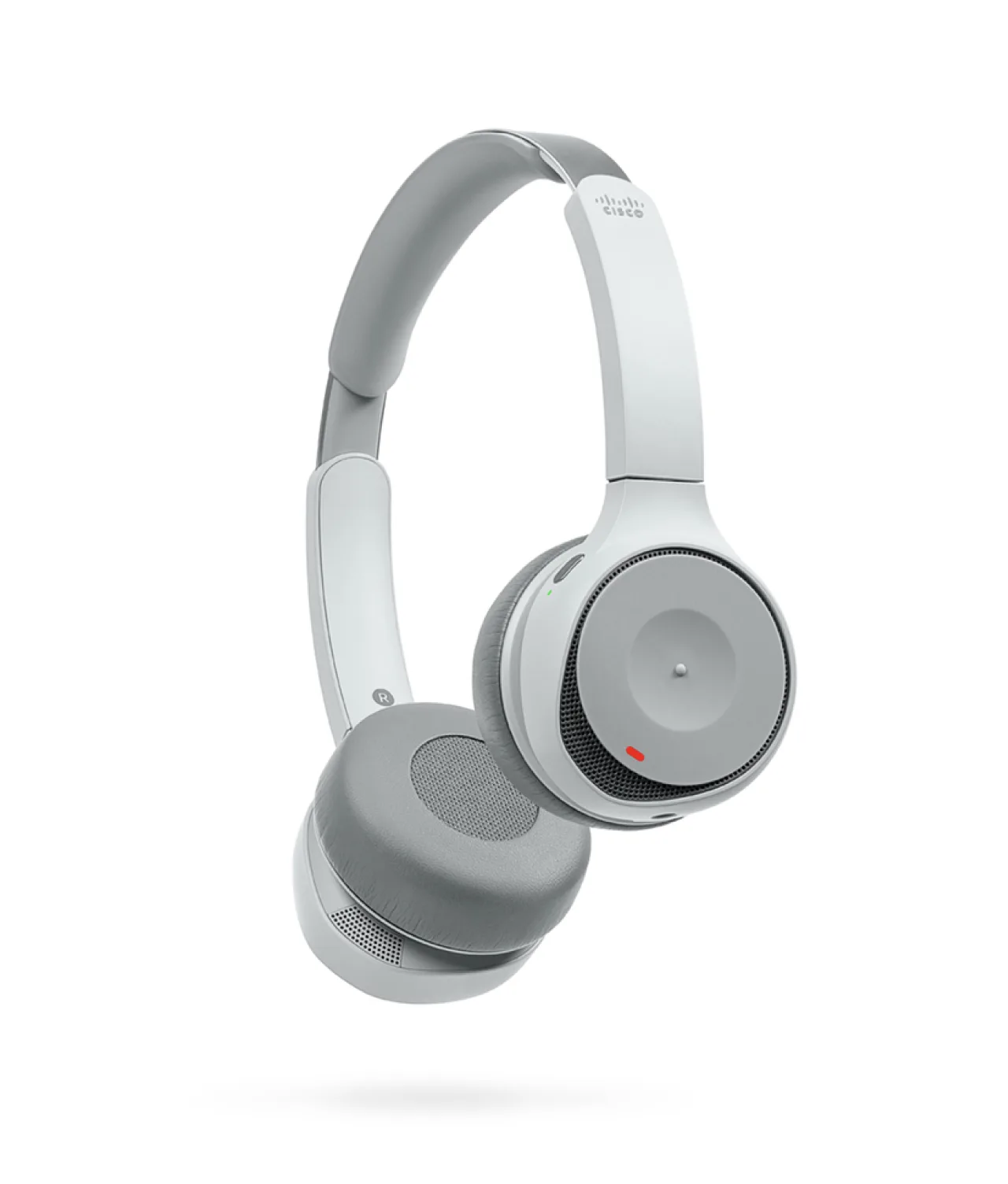 A pair of modern, over-ear, wireless headphones in light gray with cushioned ear pads and a built-in microphone, shown floating against a white background.