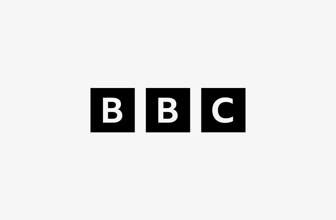 The image shows the BBC logo, featuring the letters B, B, and C, each in white inside a separate black square, on a light gray background.