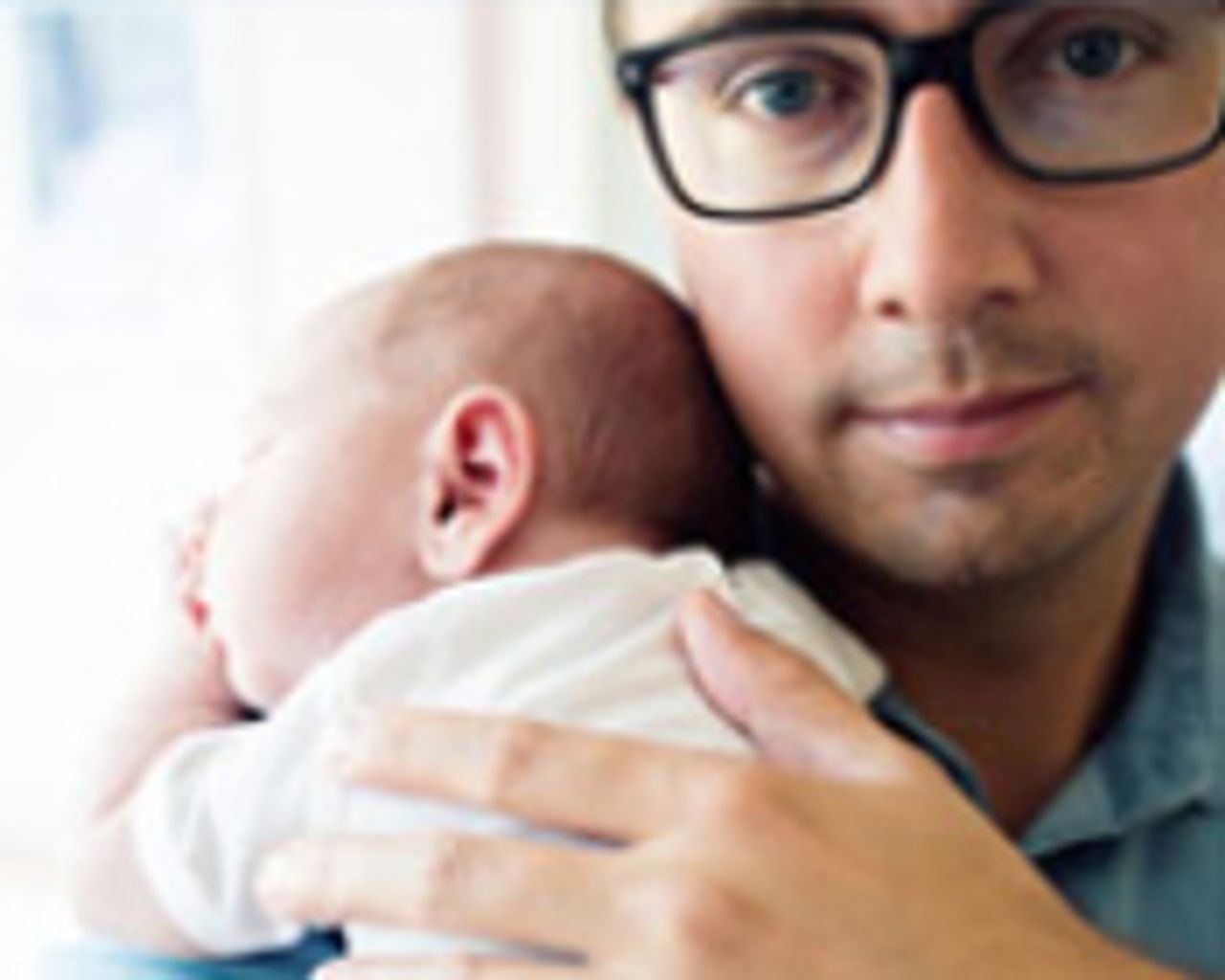 Stock image of a man and a baby