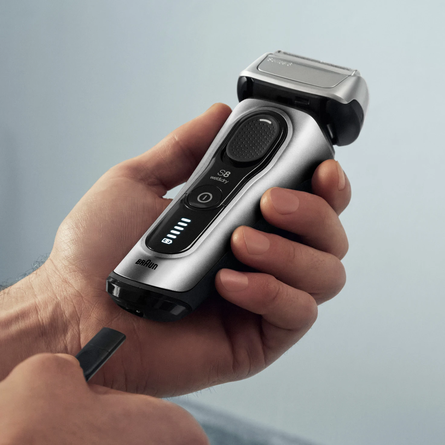 Hand holding shaver with Li-Ion battery