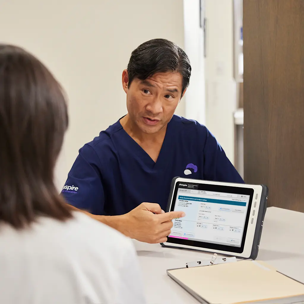 Physician Inspire Rep showing a tablet to a potential recipient