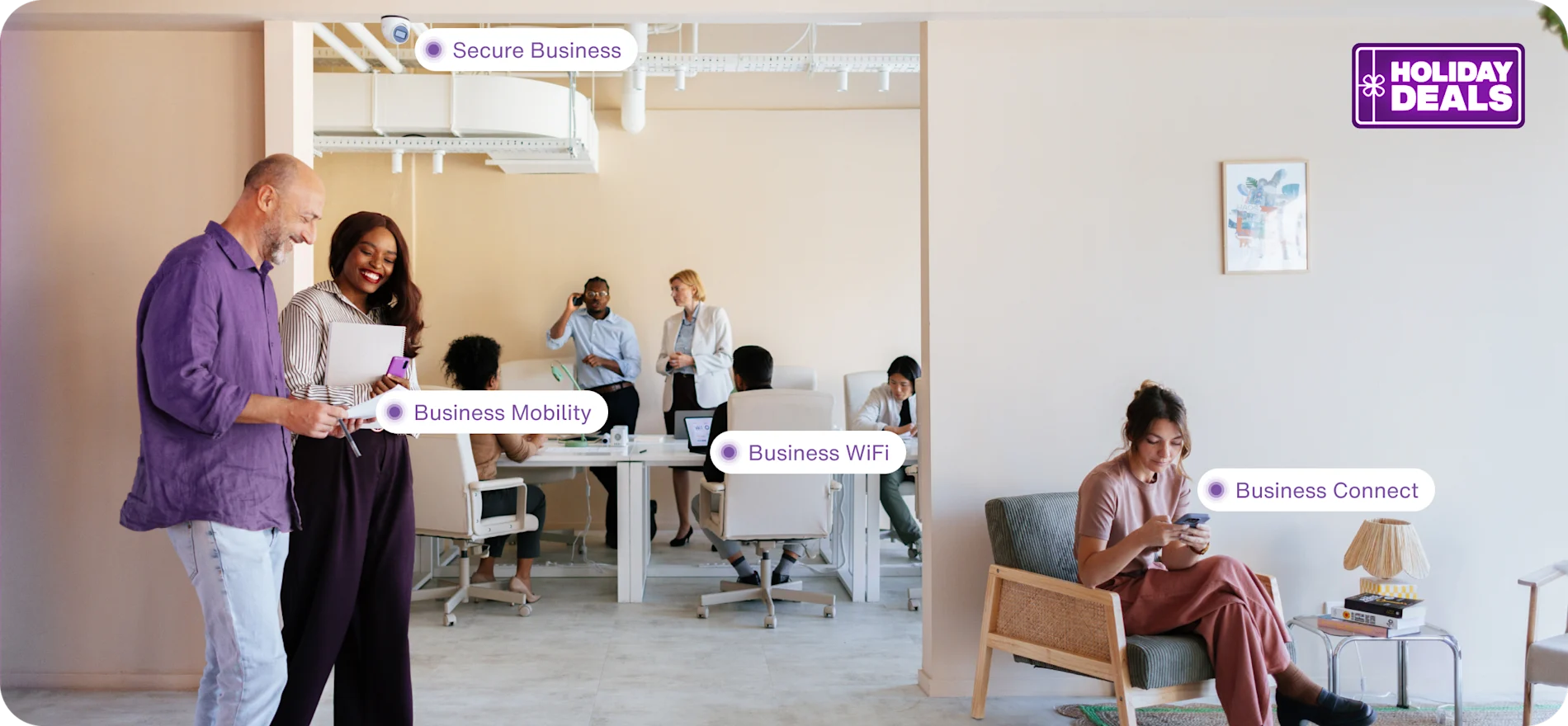 An office with various groups using all TELUS products within the workforce. A roundel reads "Holiday Sale”