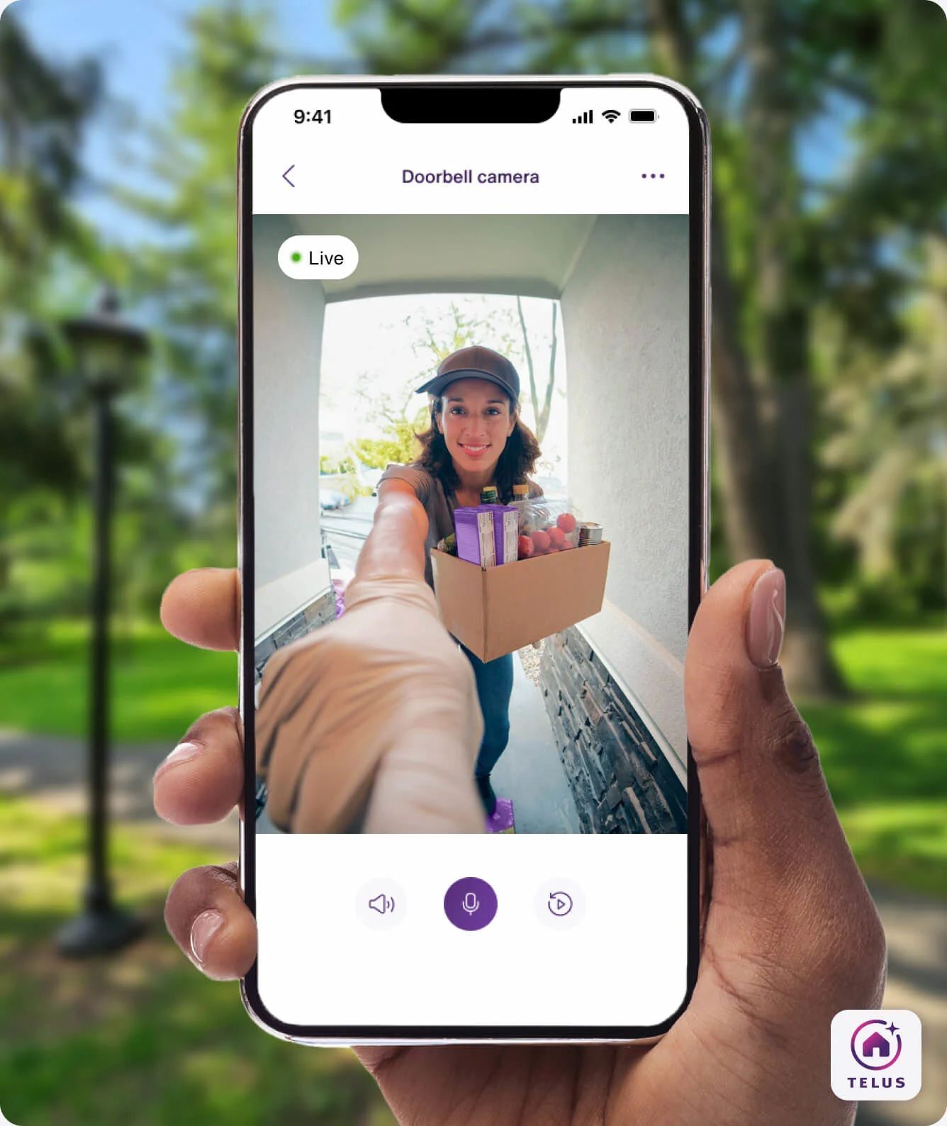 A hand holding the TELUS SmartHome+ app showing a delivery person and package with a live video from the TELUS Doorbell Camera. 