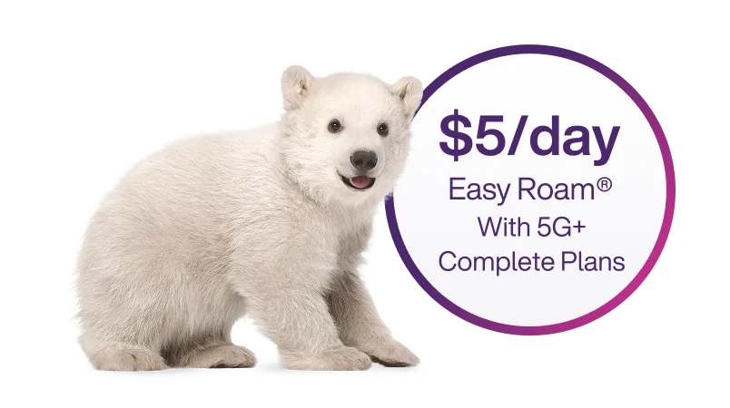 A polar bear beside a circle with text that reads, '$5/day Easy Roam® with 5G+ Complete Plans'.