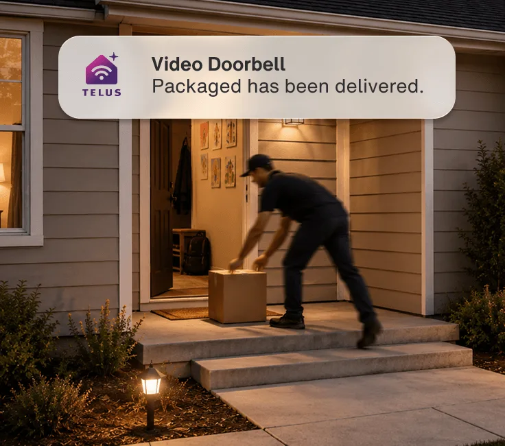 Man delivering a package on the doorstep of a house after dark. An app alert reads: “Video Doorbell - Package has been delivered.”