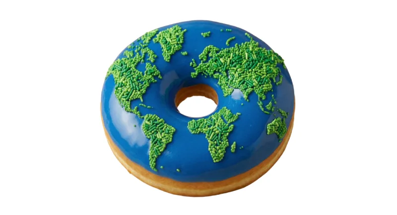 a donut decorated to resemble a map of the earth is shown.