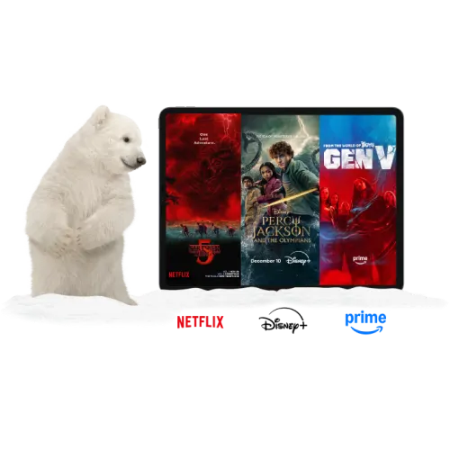 A polar bear standing next to a tablet. The tablet displays posters for Wednesday, The Lowdown and Gen V. Under the tablet are logos of Netflix, Disney+ and Amazon Prime.