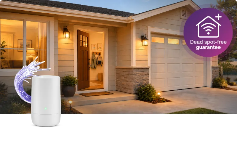 A TELUS modem next to an animation of a house. A roundel on the right reads “Dead spot-free guarantee”.