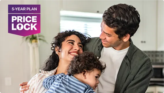 A couple holding their toddler, featuring a 5-Year Plan Price Lock badge.