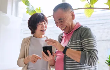 A family using a tablet together in their home