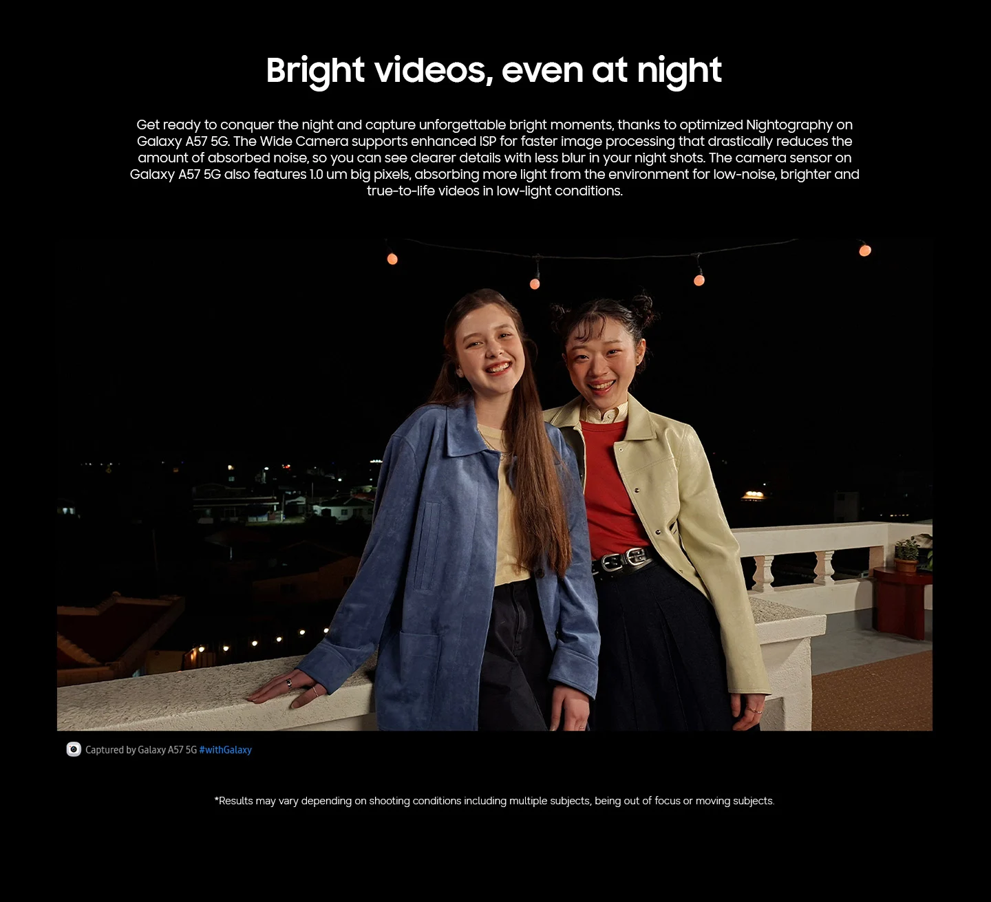 A photo taken of two girls in a nighttime setting to display A57 5G optimized Nightography feature.