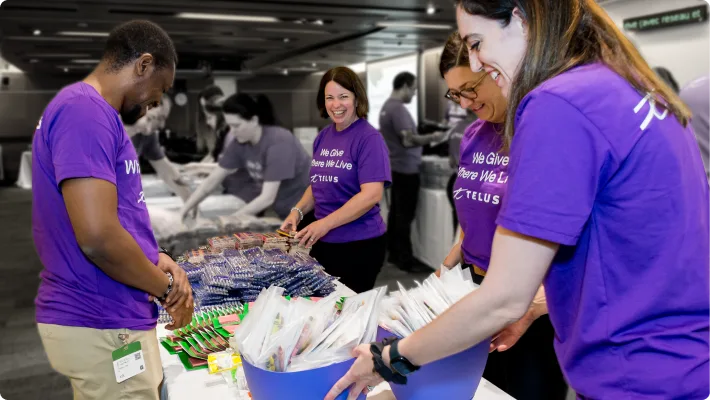 TELUS team members sort out school supplies to fill up backpacks in support of our Kits for Kids initiative.