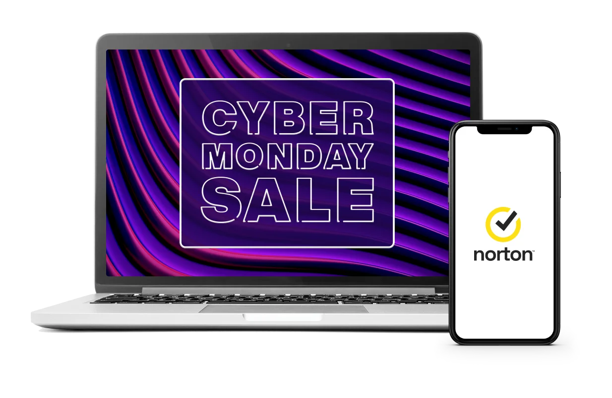 A computer featuring a neon screen reading "Cyber Monday deals" and a phone with the Norton™ logo. 