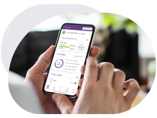 A person holding a smartphone and using the TELUS Connect app.