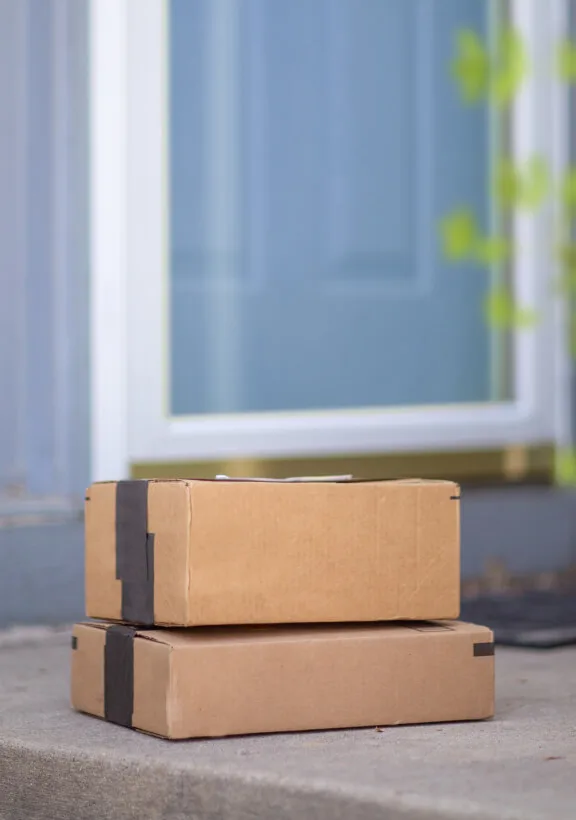 Packages are seen from the view of a TELUS Doorbell Camera. 