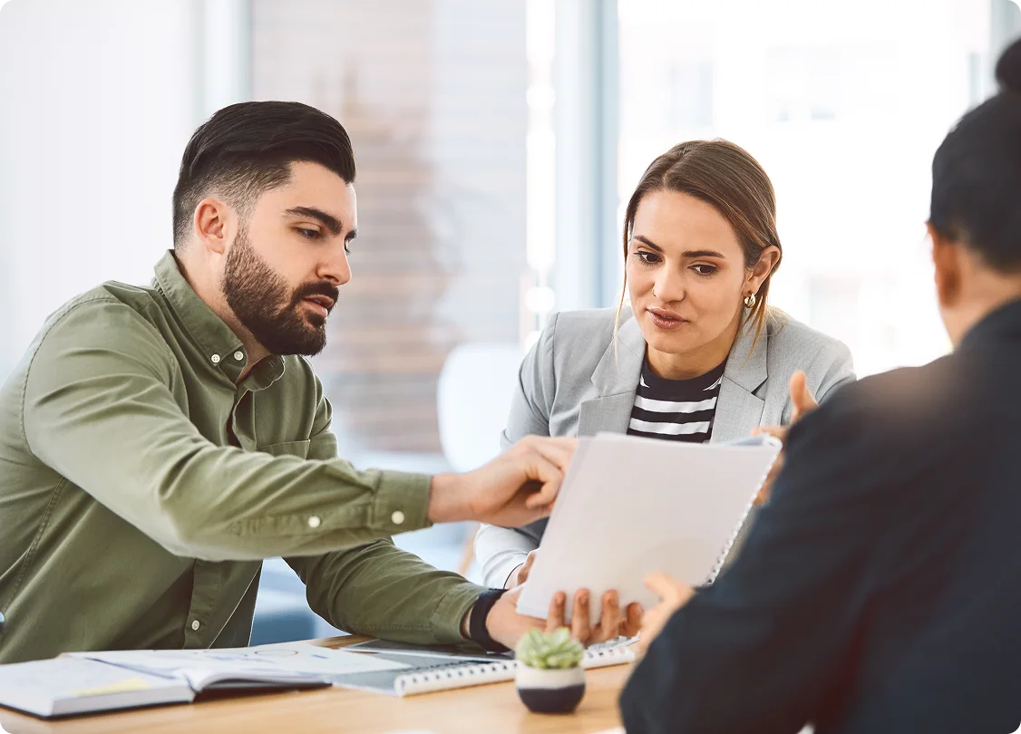 Business professionals collaborating in a meeting. 