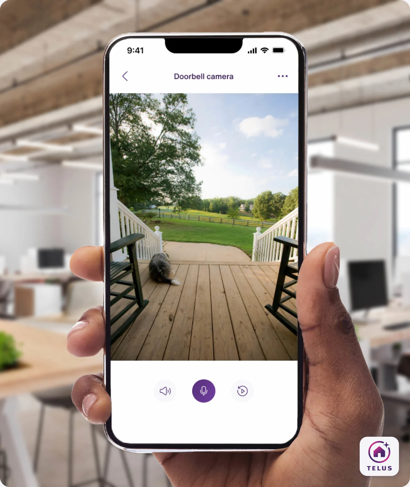 A hand holding the TELUS SmartHome+ app showing the recording from the TELUS Doorbell Camera. 