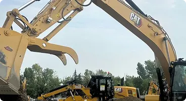 Yellow excavators operating at construction site.